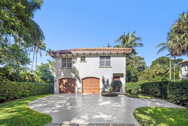 mediterranean / spanish-style house featuring a garage