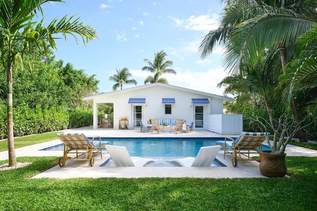 view of swimming pool featuring a yard and a patio