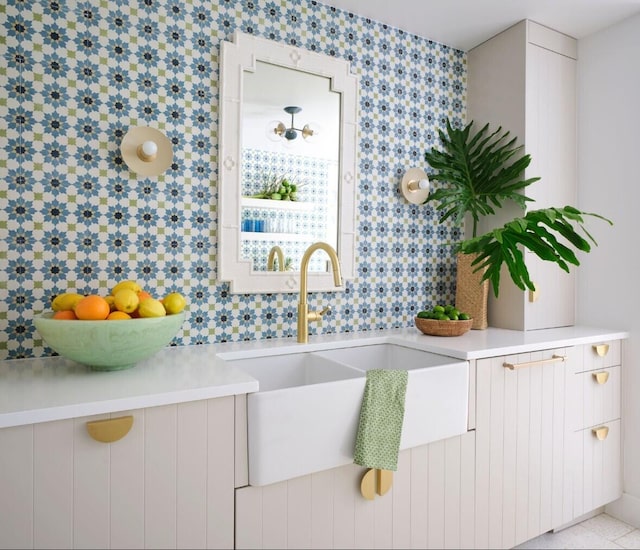 bathroom with sink and tile walls