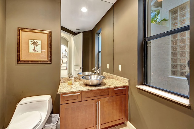 bathroom with vanity and toilet