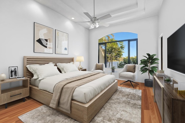 bedroom with hardwood / wood-style flooring and ceiling fan