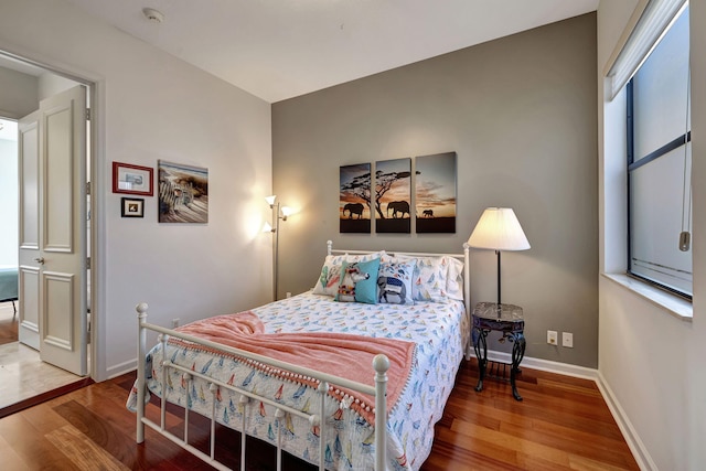 bedroom with wood-type flooring