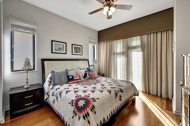 bedroom with ceiling fan and light hardwood / wood-style flooring