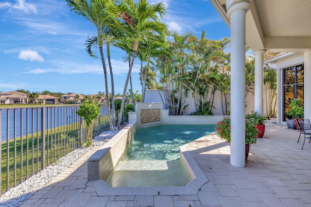 view of swimming pool with a water view