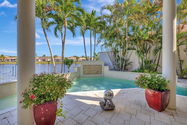 view of swimming pool with a water view