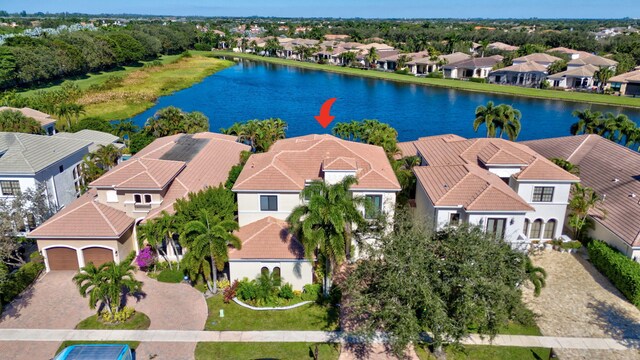 birds eye view of property featuring a water view