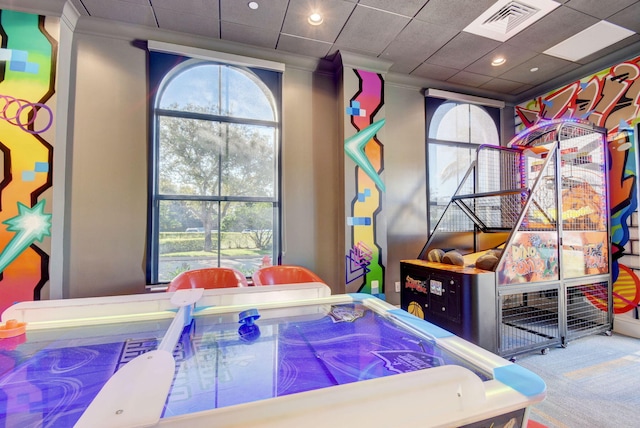 game room with carpet and ornamental molding