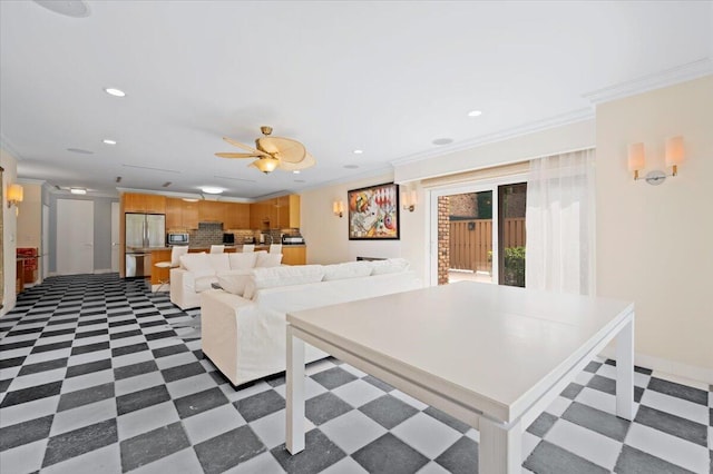 living room with crown molding and ceiling fan