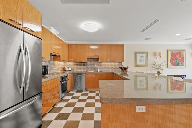 kitchen with decorative backsplash, kitchen peninsula, ornamental molding, stainless steel appliances, and sink