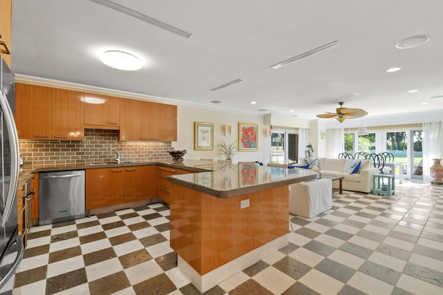 kitchen with dishwasher, backsplash, sink, crown molding, and kitchen peninsula