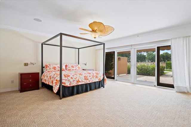 carpeted bedroom with ceiling fan, ornamental molding, and access to outside