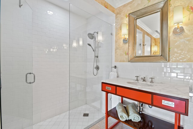 bathroom featuring vanity, an enclosed shower, and backsplash