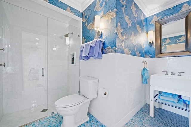 bathroom with a shower with shower door, toilet, ornamental molding, and tile walls