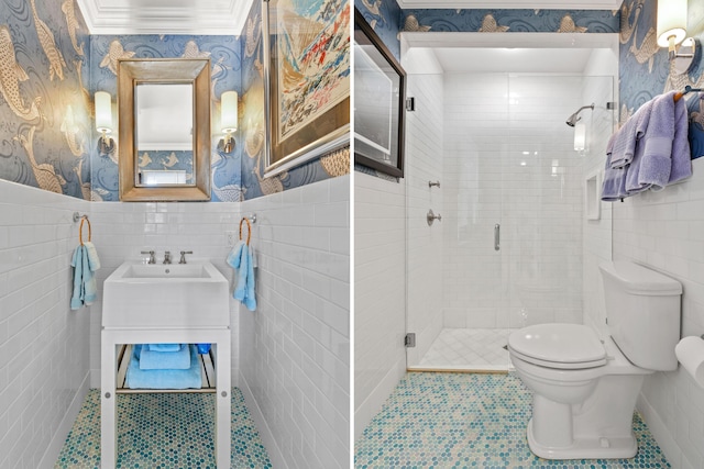 bathroom with tile patterned floors, toilet, an enclosed shower, and tile walls