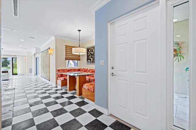 living room with ceiling fan and ornamental molding