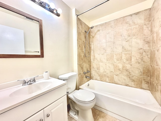 full bathroom featuring toilet, vanity, tile patterned floors, and tiled shower / bath