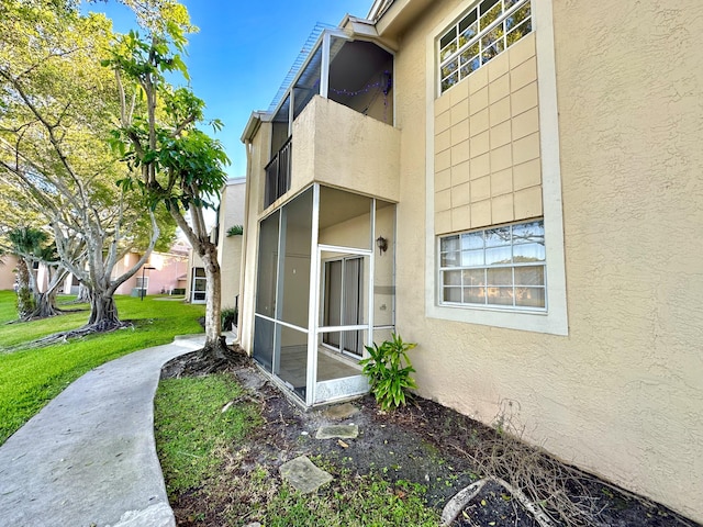 view of property exterior with a lawn