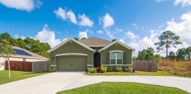 ranch-style home with a front yard and a garage