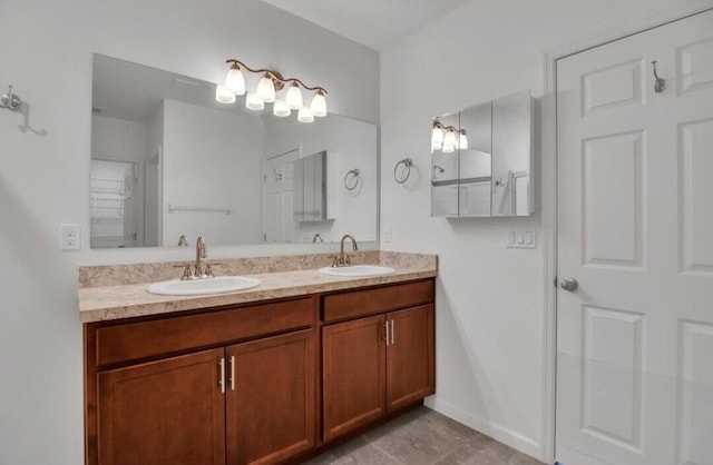 bathroom with tile patterned flooring and vanity