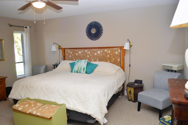 bedroom featuring ceiling fan and light carpet