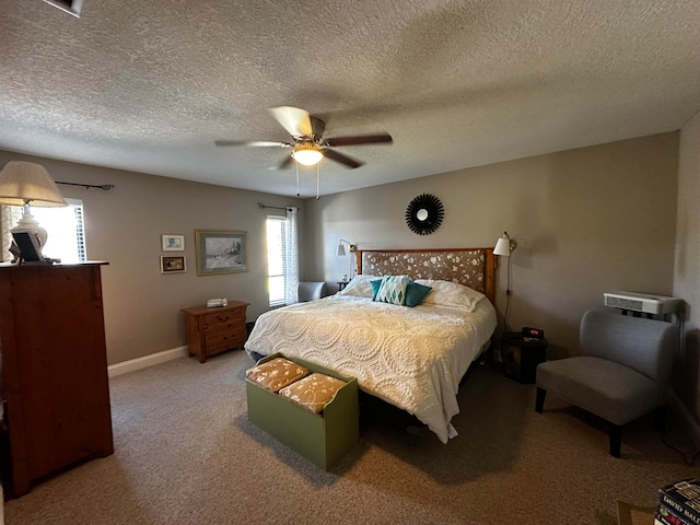 bedroom featuring carpet flooring, ceiling fan, a textured ceiling, and multiple windows