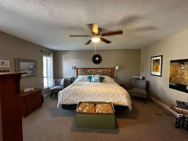 carpeted bedroom with ceiling fan and a textured ceiling