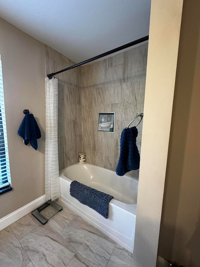 bathroom with shower / tub combo