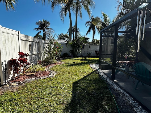 view of yard featuring a lanai