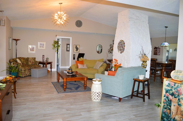 living room with an inviting chandelier, light wood-type flooring, and vaulted ceiling