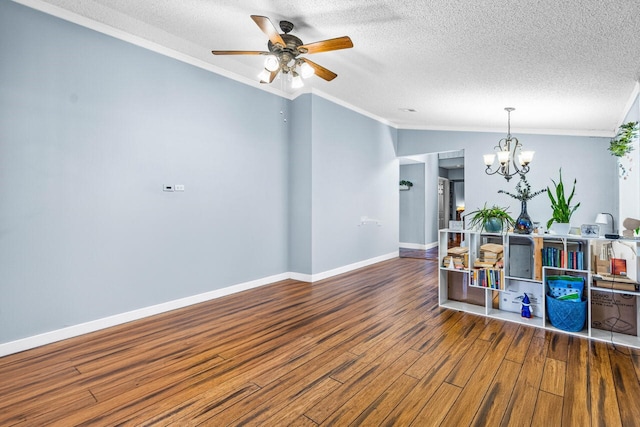 interior space featuring hardwood / wood-style floors, crown molding, and a textured ceiling