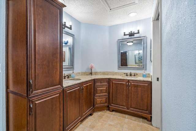 bathroom featuring vanity and a textured ceiling