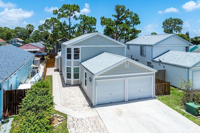 front facade with central AC and a garage