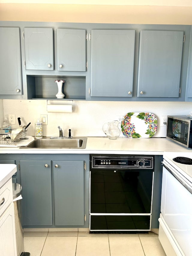 kitchen featuring sink, electric range, gray cabinets, light tile patterned floors, and black dishwasher