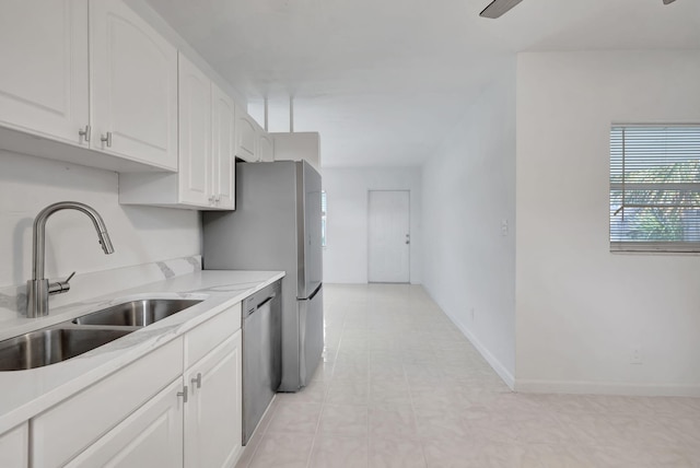 kitchen with white cabinets, sink, and stainless steel appliances