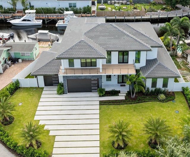 birds eye view of property with a water view