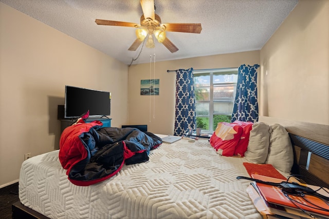 bedroom featuring a textured ceiling and ceiling fan