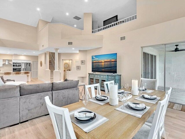 kitchen featuring white cabinets, sink, wall chimney exhaust hood, and stainless steel appliances