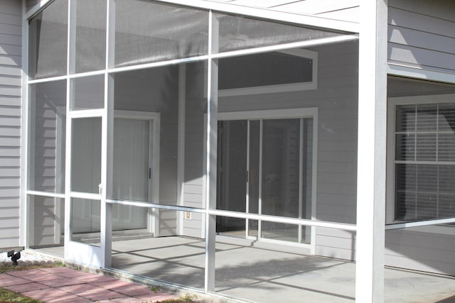 exterior space featuring a sunroom