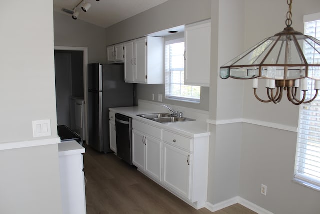 kitchen featuring white cabinets, stainless steel appliances, plenty of natural light, and sink