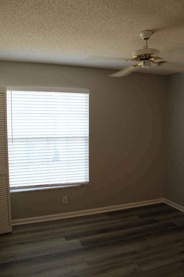 unfurnished room with dark hardwood / wood-style floors and a healthy amount of sunlight