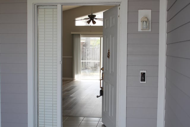 entrance to property featuring ceiling fan