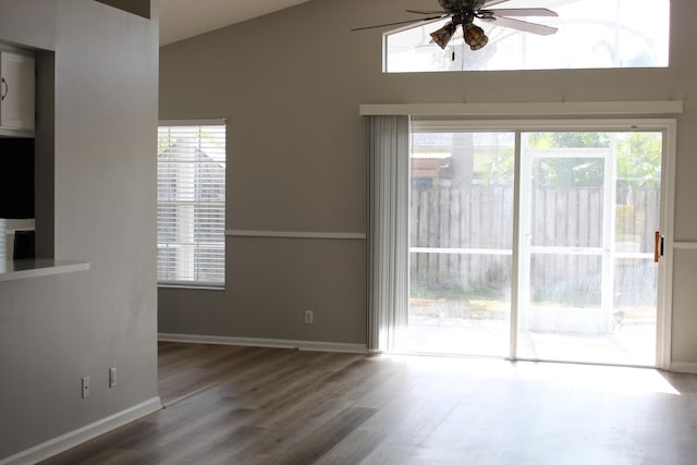 interior space with hardwood / wood-style floors, high vaulted ceiling, and ceiling fan