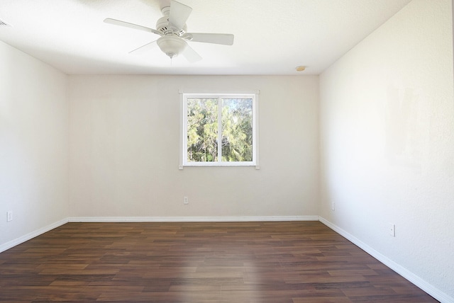 unfurnished room featuring ceiling fan and dark hardwood / wood-style flooring