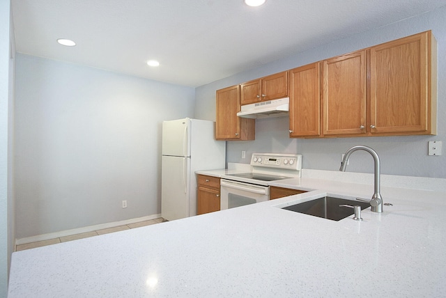 kitchen featuring white appliances and sink