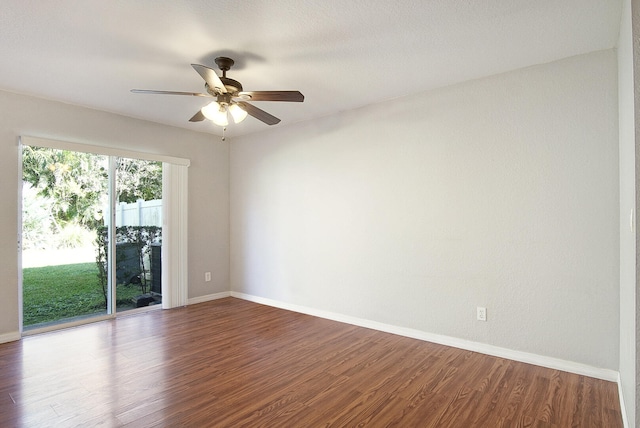 empty room with hardwood / wood-style flooring and ceiling fan