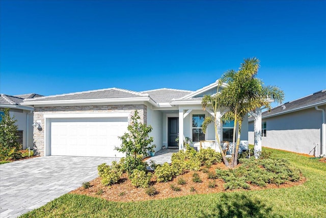 ranch-style home featuring a garage