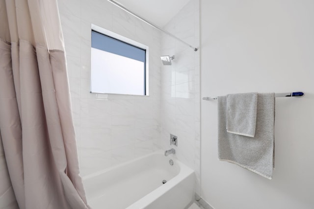 bathroom featuring shower / bath combo with shower curtain