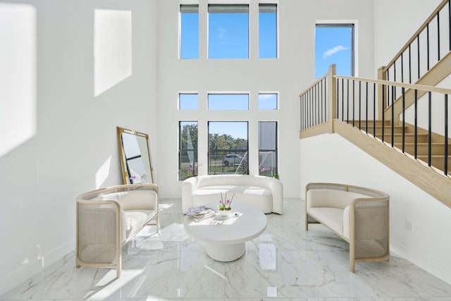 living room with a towering ceiling