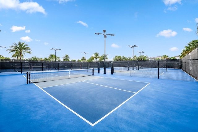 view of tennis court featuring basketball court