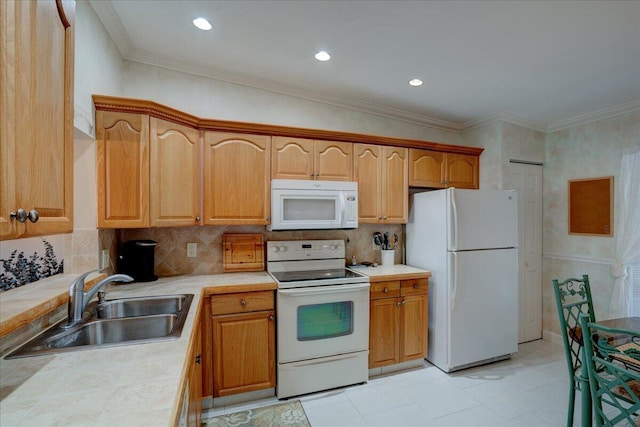 kitchen with white appliances, sink, ornamental molding, tasteful backsplash, and tile counters